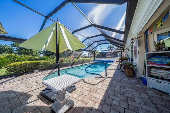 Large pool, newly screened cage with 50' wide window screen, no middle bar to obstruct your view.