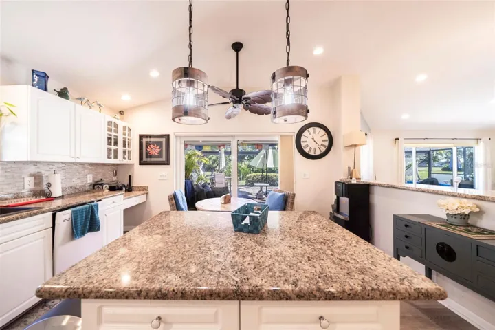 kitchen open to the great room on the right, and sliders onto the lanai