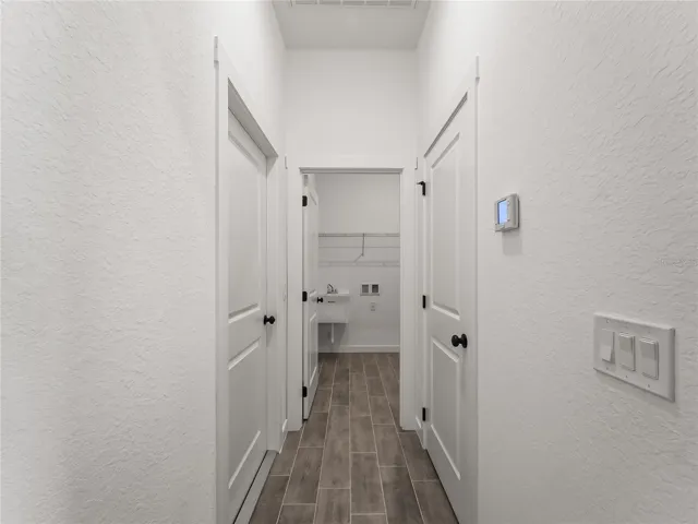 Hallway into interior laundry and garage