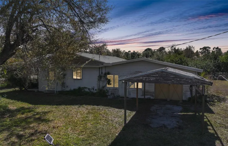 Home on 3 Lots, Carport and 1 Car Garage, In-Ground Pool ( photographer added sunset )