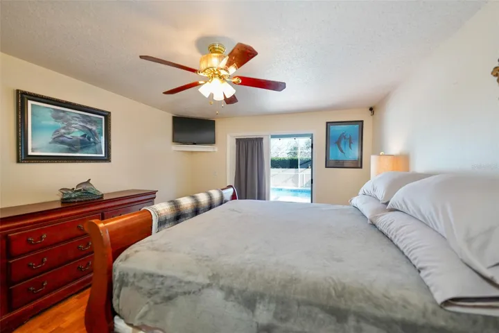 Primary Bedroom with door to pool area