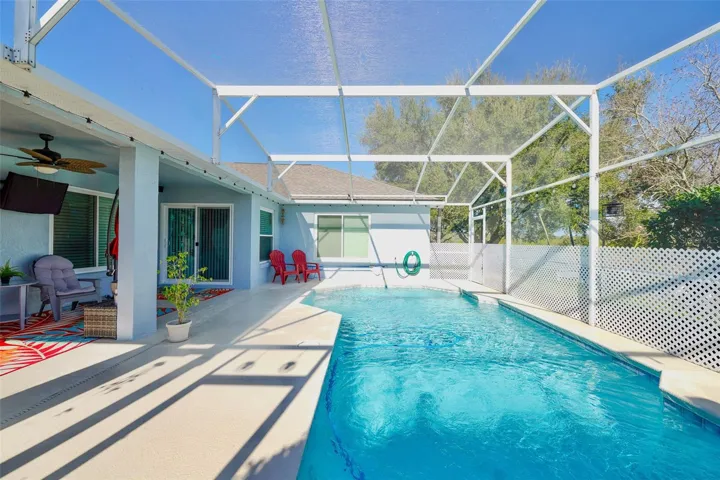 Screened in pool area. Freshly painted outside of home.