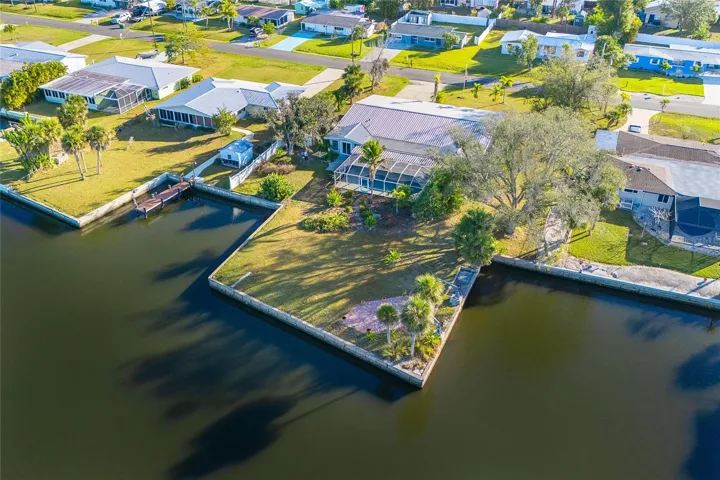 Rear Aerial View - Gottfried Creek - .66 acre Lot - 215 feet of Seawall with Two Boat Basins & Moorings on Three Sides. Note the water depth adjacent to the Seawall