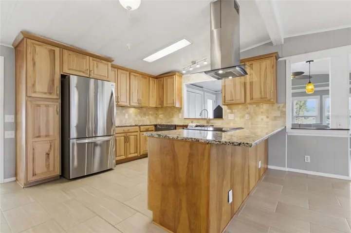 Updated kitchen with Hickory Wood Cabinets, Granite Countertops, & Stainless Steel Appliances