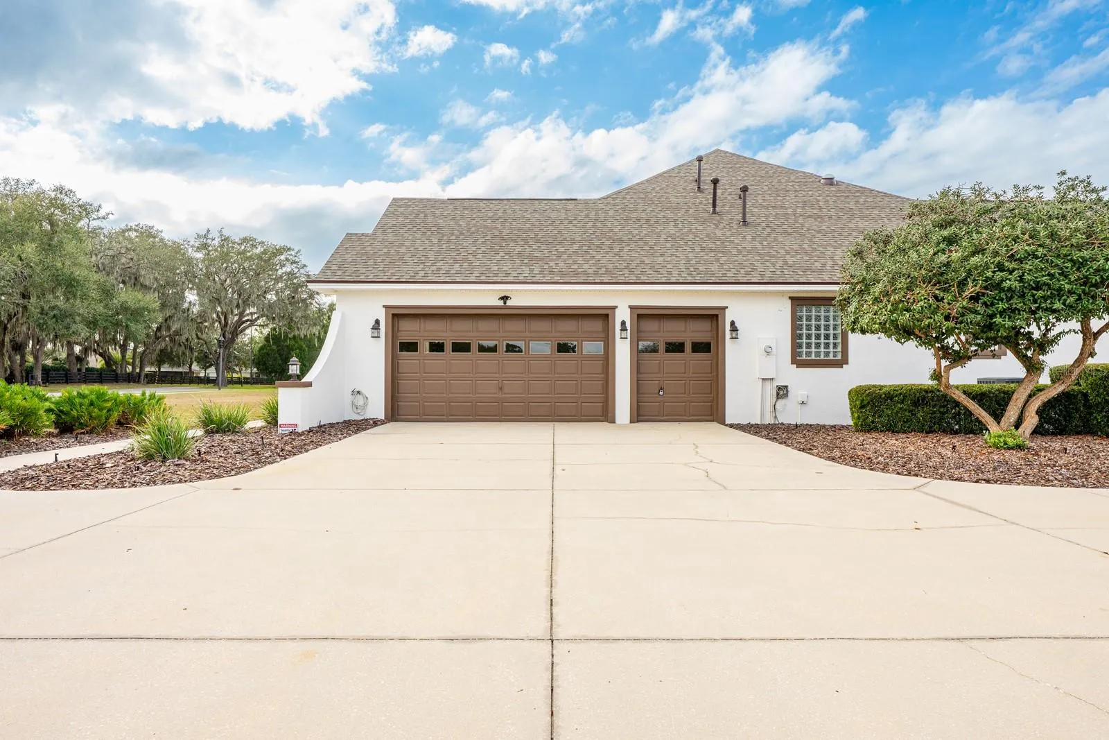 Oversized side facing garage with golf cart parking.