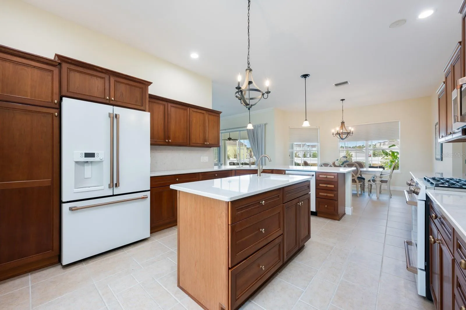 The home chef’s dream kitchen features sleek CULTURED GRANITE COUNTERTOPS, an ISLAND with prep sink, and NEW GE CAFE APPLIANCES, ideally suited for both everyday living and entertaining with ease.