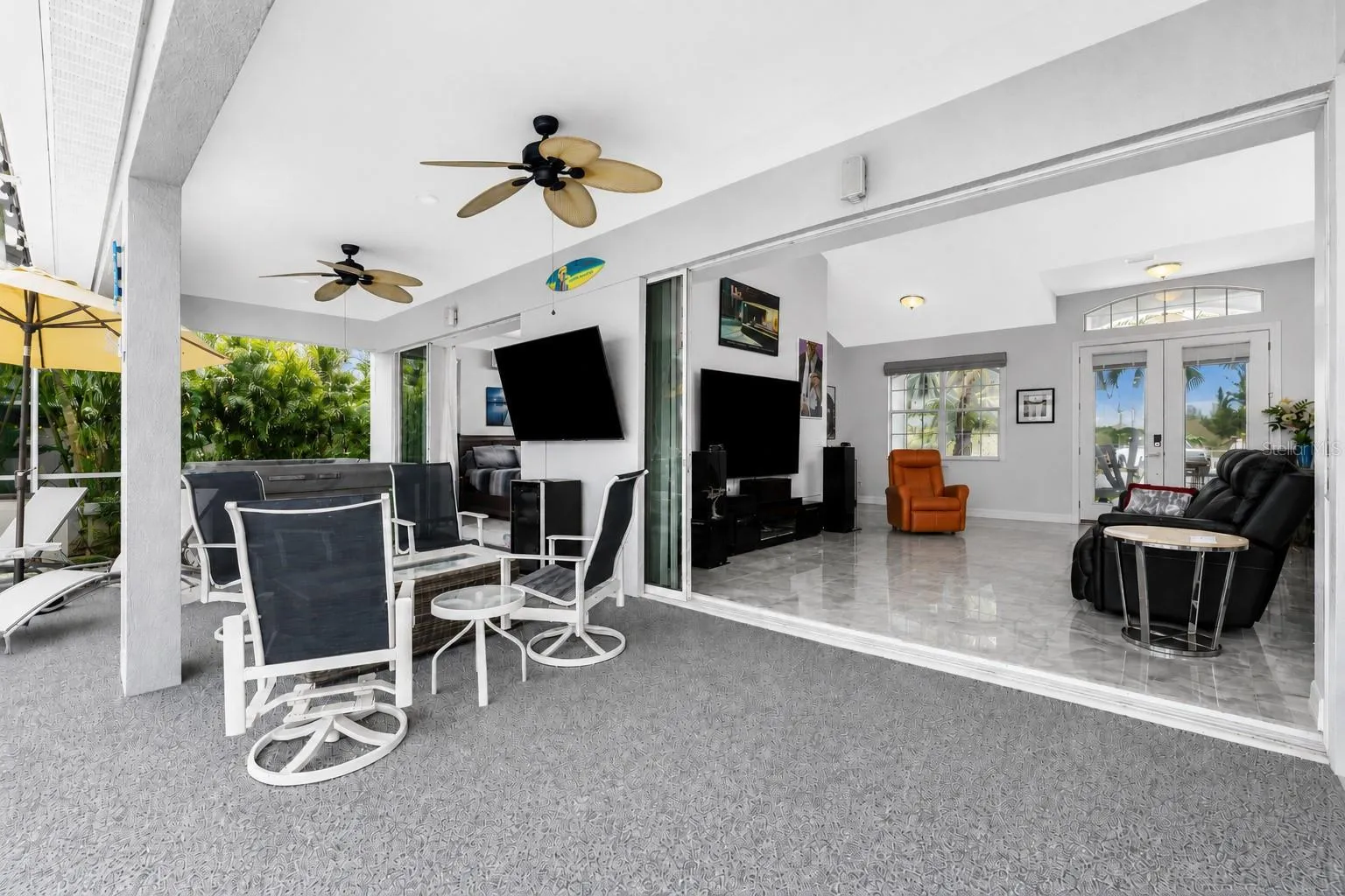 Pocket sliders enable you to open up the entire back of the house.  Great inside/outside living.