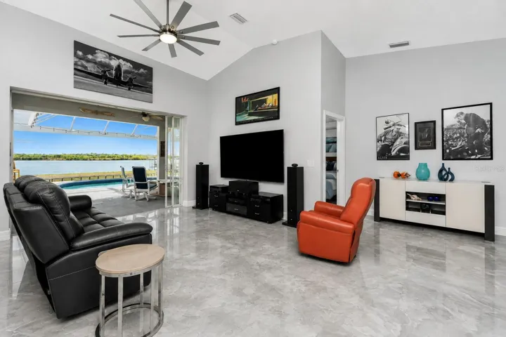 Modern and bright open concept family room with vaulted ceilings.