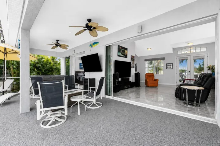 Pocket sliders enable you to open up the entire back of the house.  Great inside/outside living.