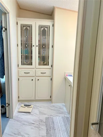 Primary bathroom linen cabinet.
