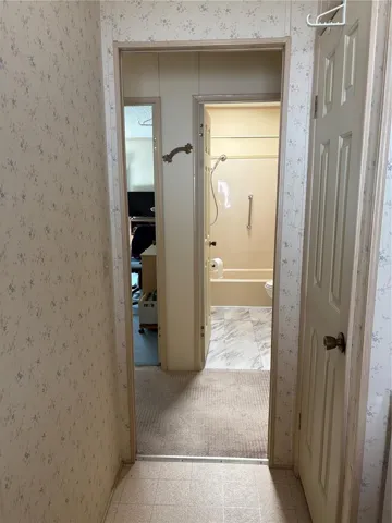 Laundry room entrance off of carport.