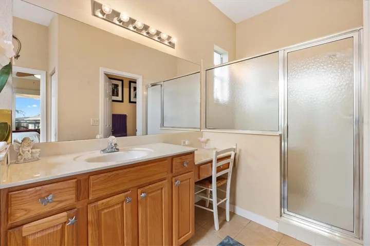 Dressing table with second vanity. large walk--in shower.