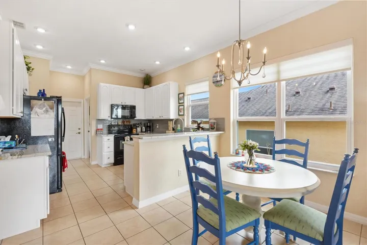 Breakfast nook looking toward kitchen.  All new windows in home in 2021.