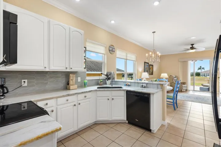 Kitchen looking toward breakfast nook, family room, lanai.