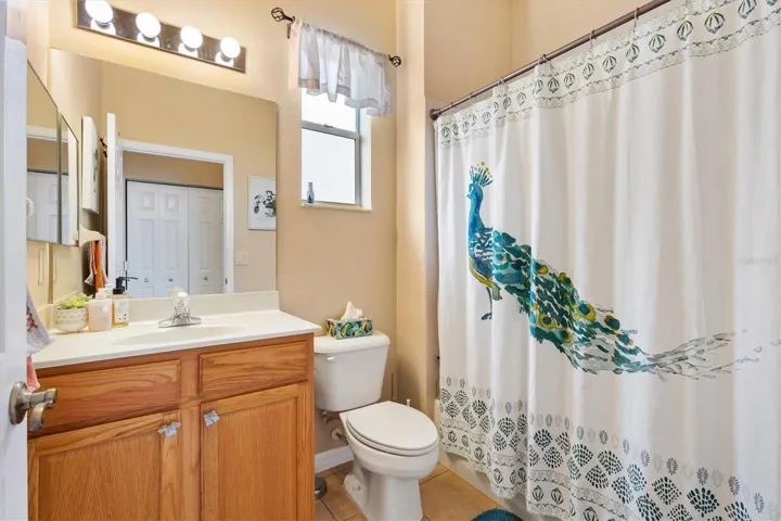 Guest bath with tub/shower combo.
