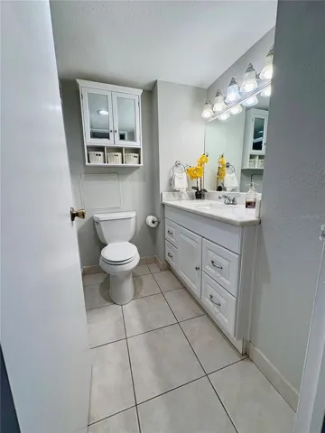 Bathroom with full sized vanity mirror