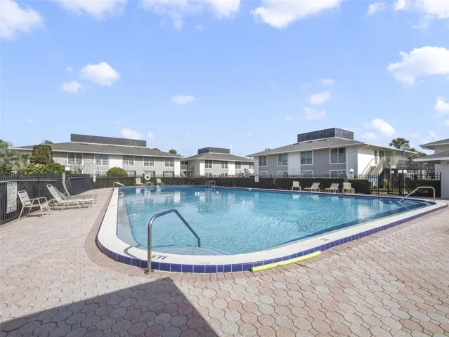 Residents of Mai Kai enjoy a variety of COMMUNITY AMENITIES including a sparkling swimming pool, tennis courts, and beautifully maintained grounds surrounded by lush landscaping and water features.