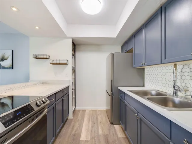 The open Kitchen features abundant cabinet and counter space.