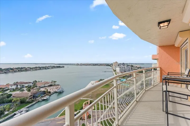 West-facing balcony view showcasing the top-floor perspective and natural light.