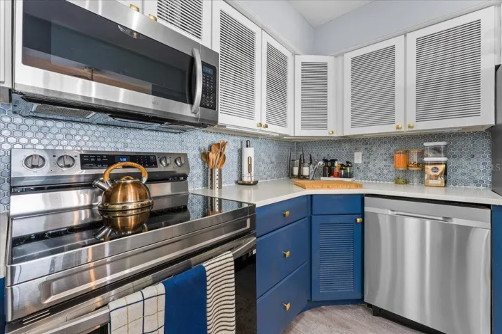 Stunning kitchen with modern finishes, stone countertops &amp; premium backsplash