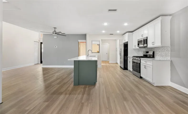 Kitchen view from dining into laundry room