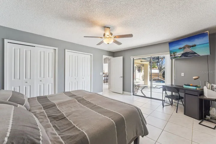 Third bedroom with view of pool