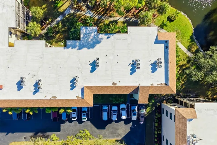 Roof / Layout AerialOverhead view highlighting building layout, parking, and proximity to community features