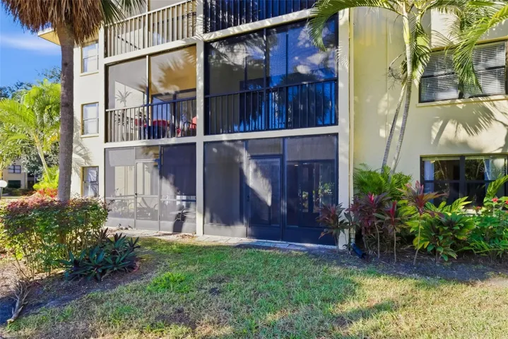 Ground floor unit with screened lanai and direct access to green space in DeSoto Square Villas