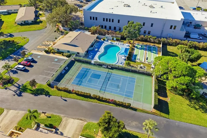 Aerial view of community pool and recreation area in DeSoto Square Villas Bradenton
