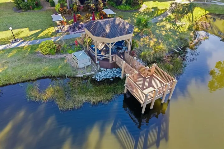 Scenic waterfront gazebo overlooking pond – a peaceful retreat within the community