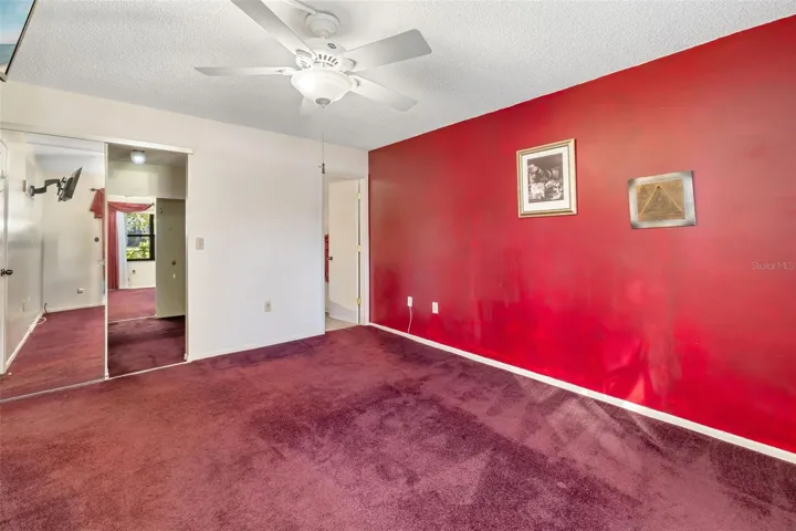 Spacious primary bedroom with large closet and private bath access