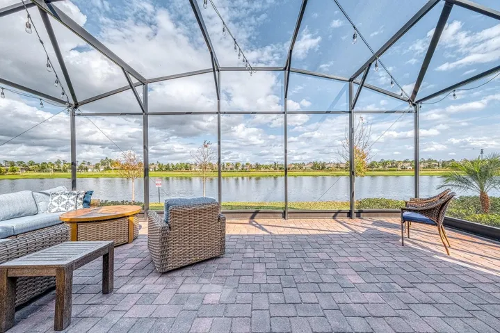 Stunning pond view from the 27 x 30' extended screened patio.