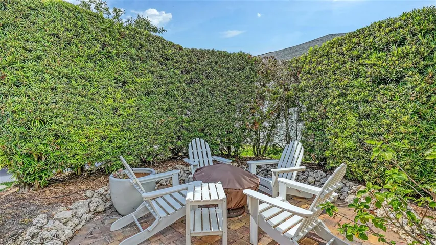 Do note the 9ft boxwood hedge surrounding the fire pit seating area. This backyard oasis has many interesting nooks and crannies.