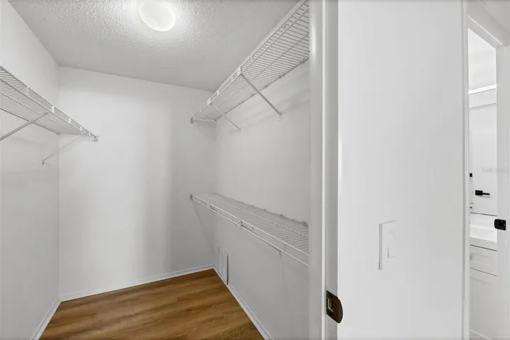 Walk in closet in primary bedroom
