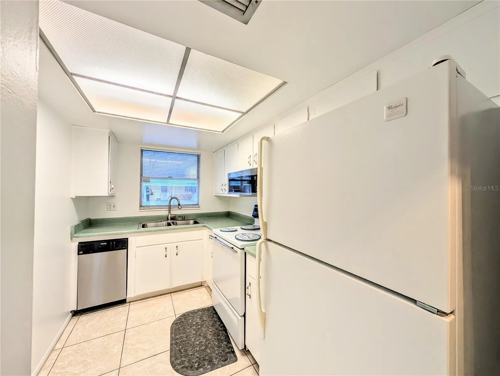 Well equipped kitchen with a range, refrigerator, dishwasher, microwave.
