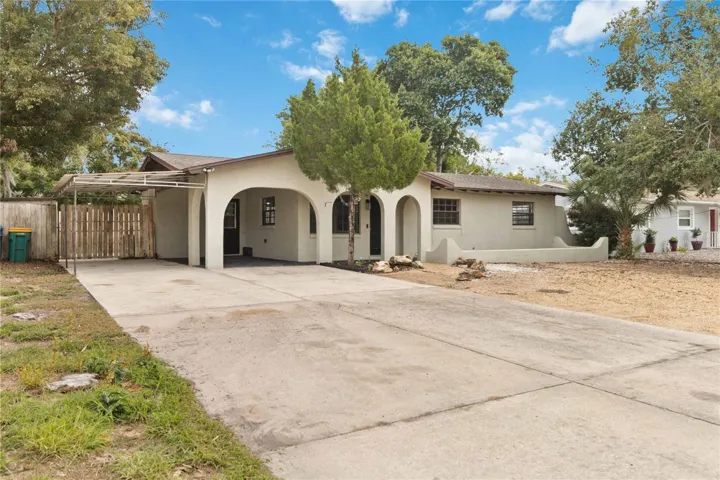 Full frontal view of home and yard.