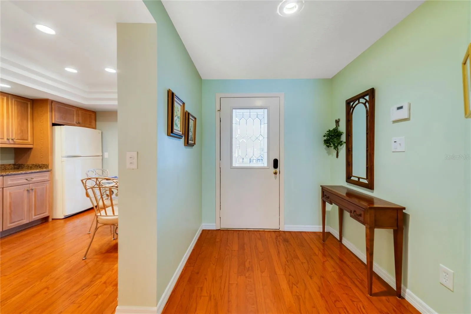 Spacious Entry Foyer with Wood Flooring