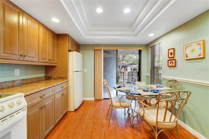 Ample Eating Space in Kitchen with Tray Ceiling