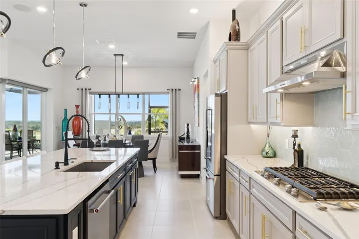 Other Upgrades include Hexagon Tile Backsplash, Cabinet Hardware, Under Cabinet Lighting, Over Cabinet Lighting and Pendant Lights!