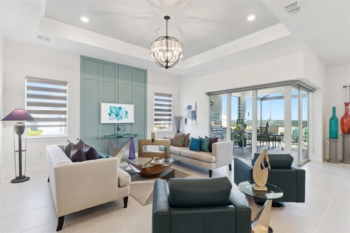 Upgrades include Tray Ceiling with Accent Paint & additional lights,  Board and Batten Accent Wall, Upgraded Light Fixture and Window Treatments!