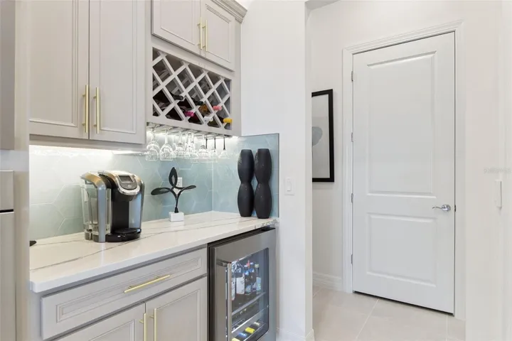 Convenient Entertainment Center!  Great for Coffee Bar or Wine or Cocktail Service!  Kitchenaid Wine Fridge Included!