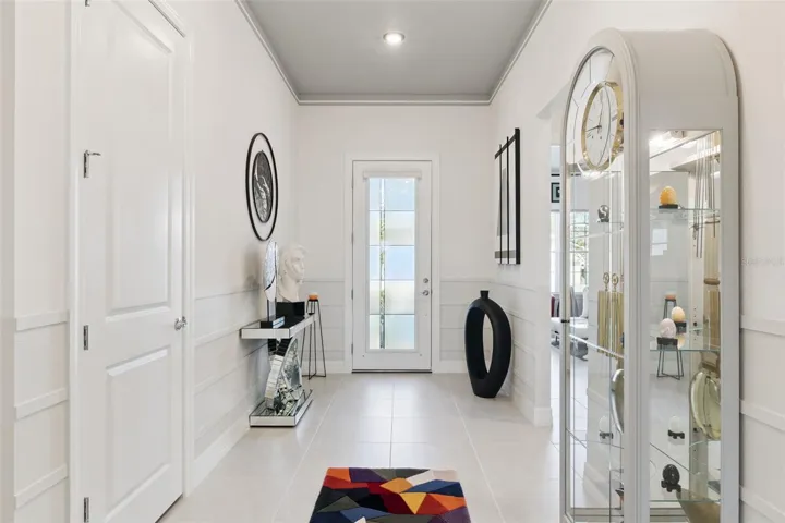 Welcoming Foyer with Accent Walls and  Custom Painted Ceiling!