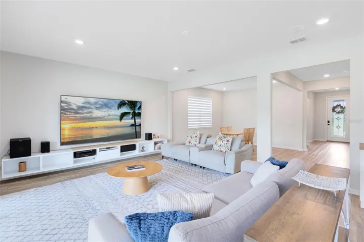 Surround sound wiring is in place for both upstairs and downstairs zones, with built-in ceiling speakers in the living room. Whole-home Ethernet wiring includes five exterior ports and six ceiling-mounted ports, plus hardwired access in every room.