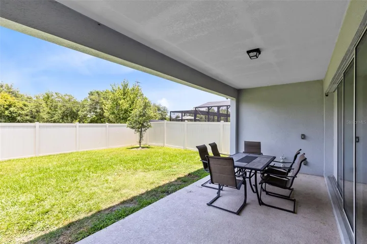 Large covered back lanai with plumbing for summer kitchen.