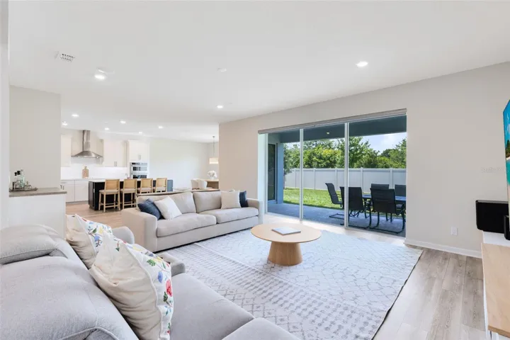 Surround sound wiring is in place for both upstairs and downstairs zones, with built-in ceiling speakers in the living room. Whole-home Ethernet wiring includes five exterior ports and six ceiling-mounted ports, plus hardwired access in every room.