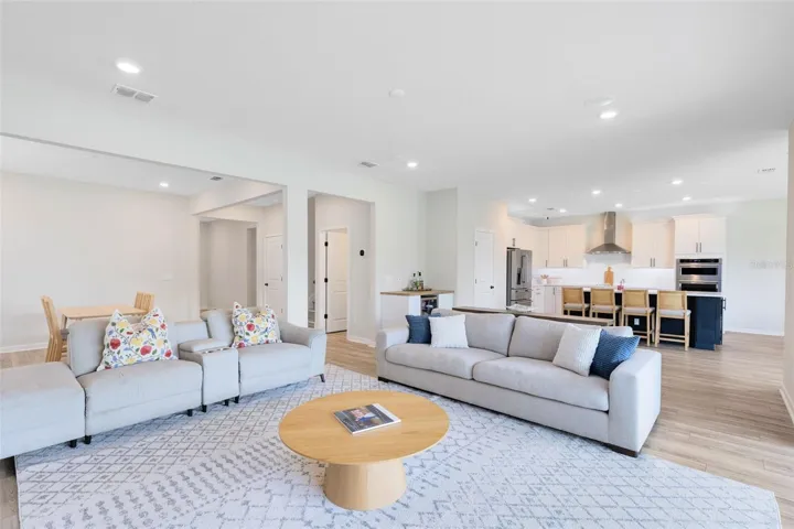 Surround sound wiring is in place for both upstairs and downstairs zones, with built-in ceiling speakers in the living room. Whole-home Ethernet wiring includes five exterior ports and six ceiling-mounted ports, plus hardwired access in every room.