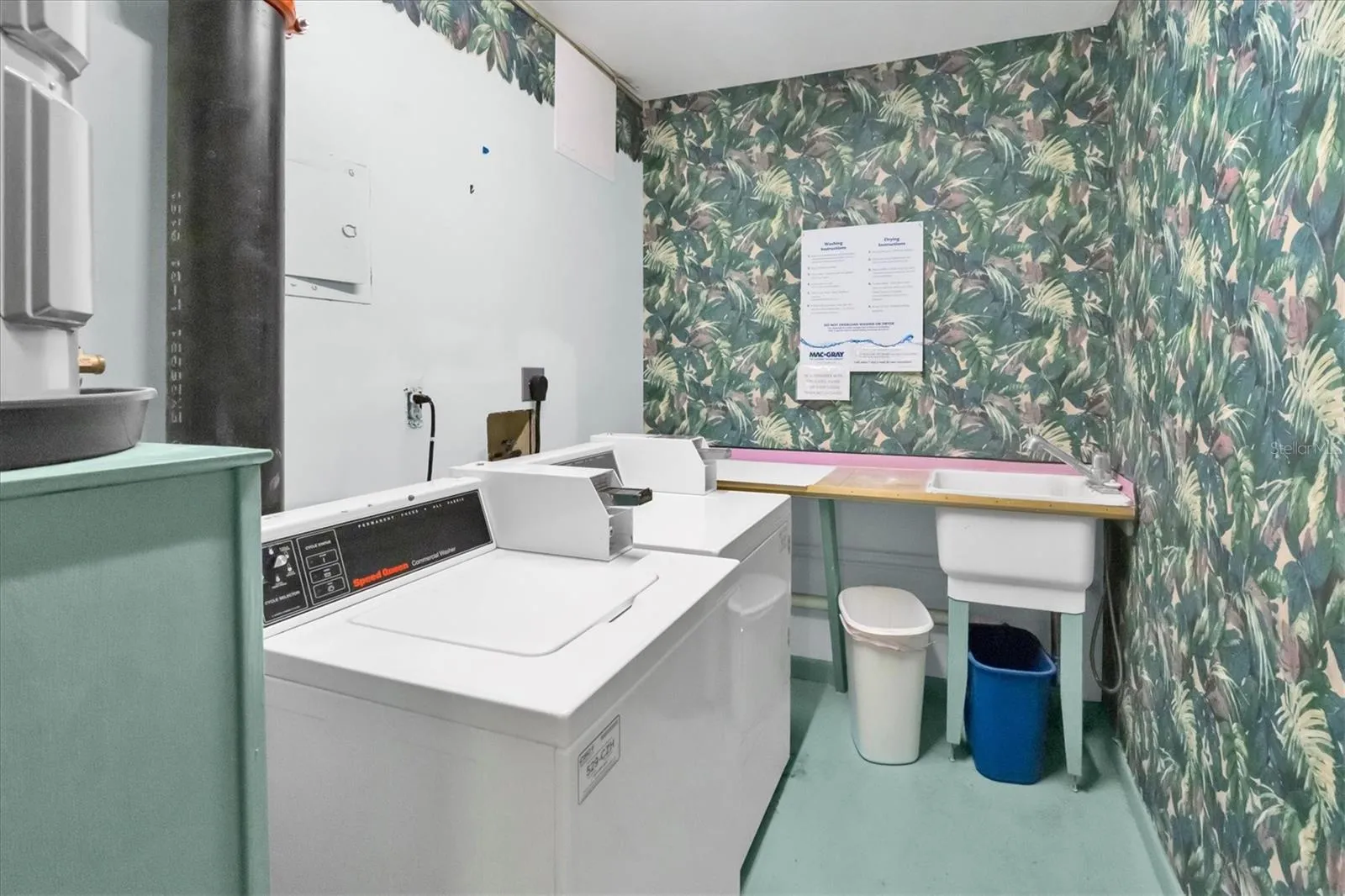 Laundry room is  across from unit