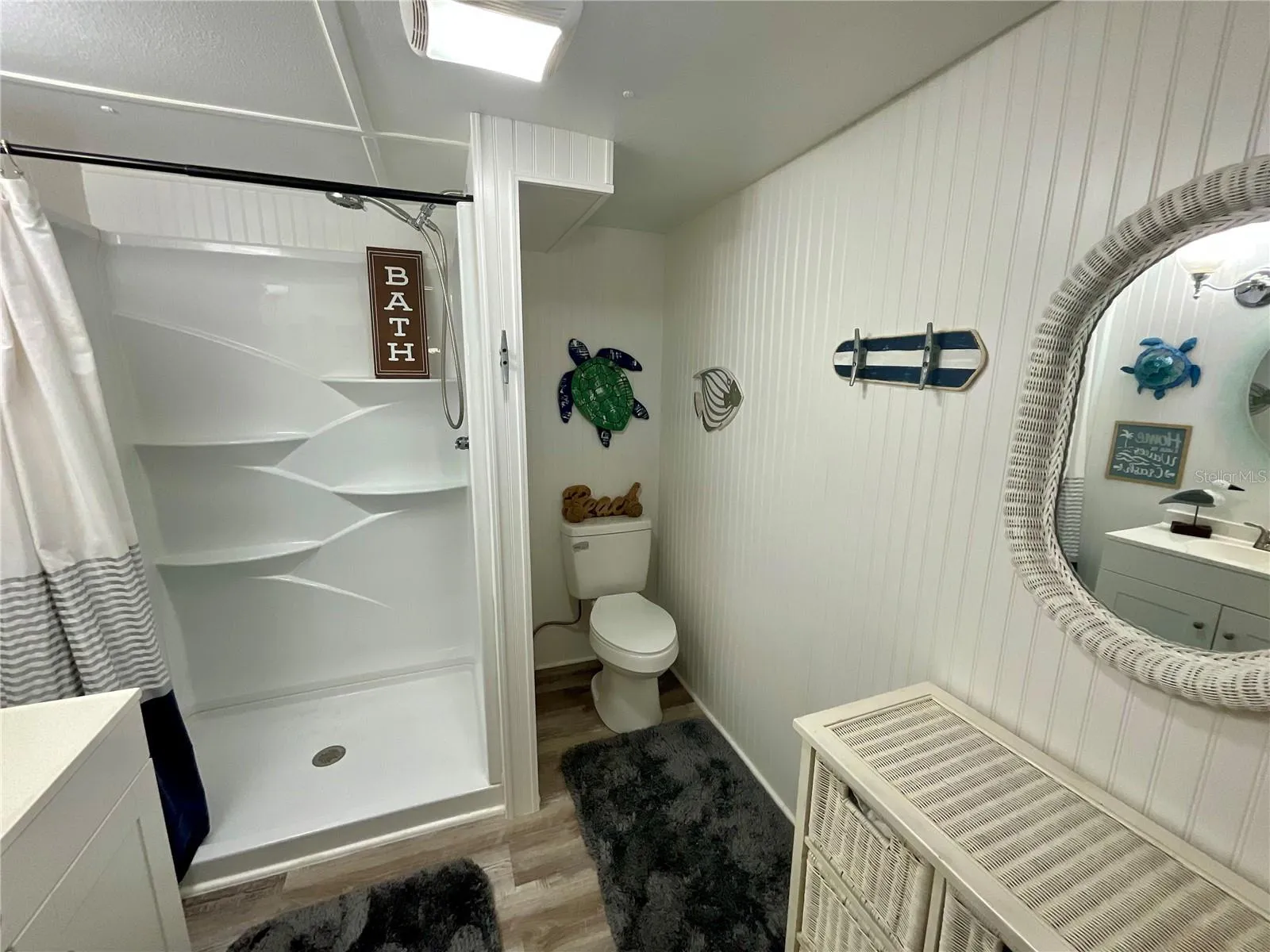 Hall bathroom:  New toilet, stall shower insert and lighting. Room is 7.5’ X 8’