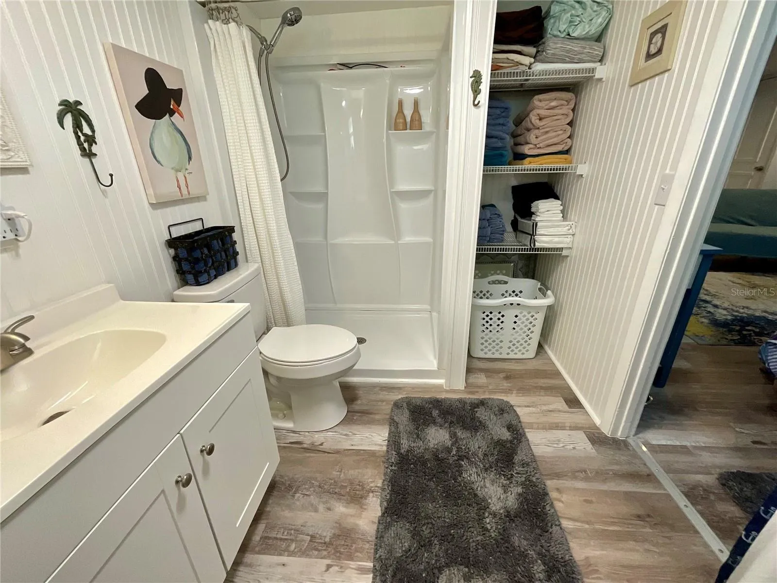 6.5’ x 9’ bathroom with linen closet and new stall shower insert