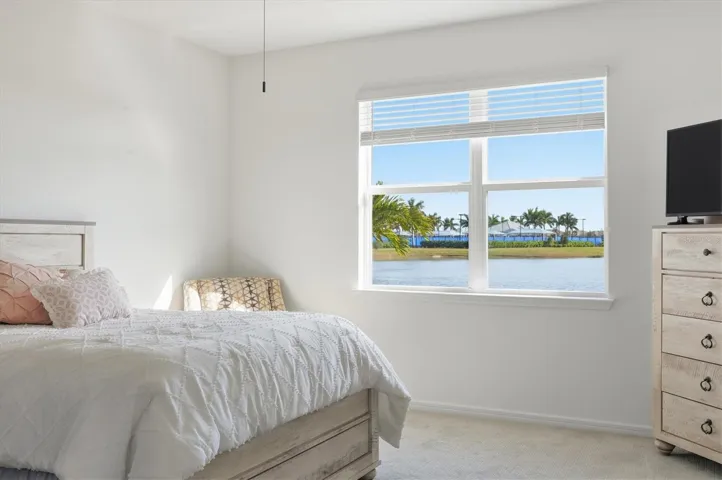 Primary bedroom presents big water views...
